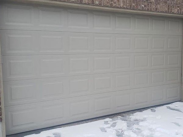 Exterior view of a 9 x 7 feet white garage door