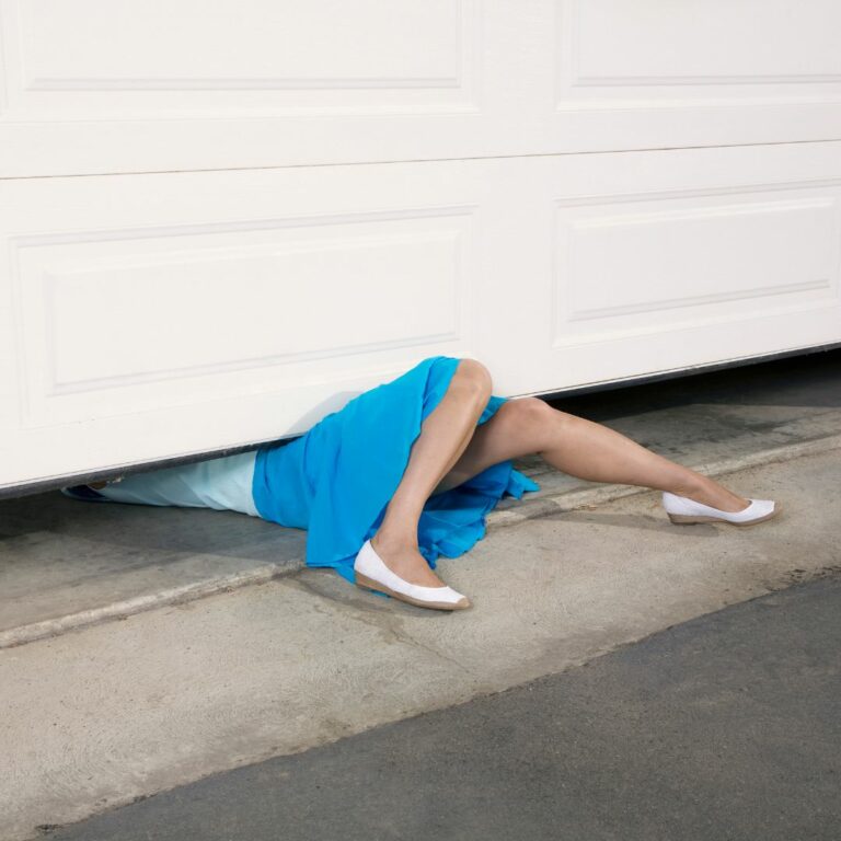 Garage door repair accident - an image showing a lady under a garage door repair accidents done
