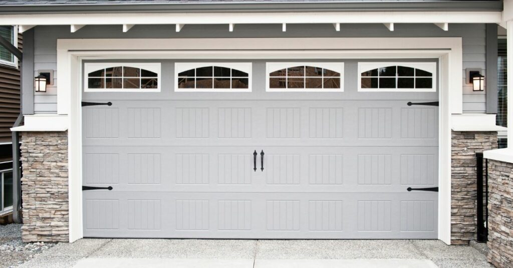 an image showing a newly fixed garage door panel replacement near me 